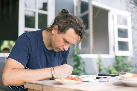 Man Sketching Outdoors