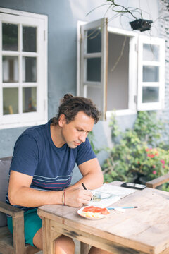 Man Sketching Outdoors