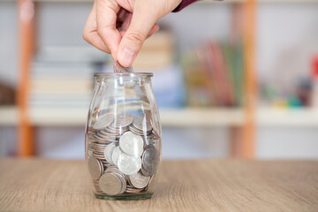 Put the coin in the glass bottle