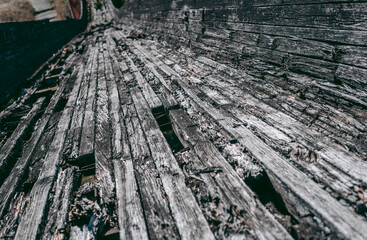 Old abandoned wooden bobsleigh track in summer by daylight
