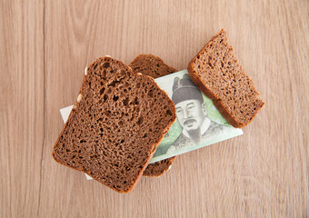 South Korean won banknotes and bread slices