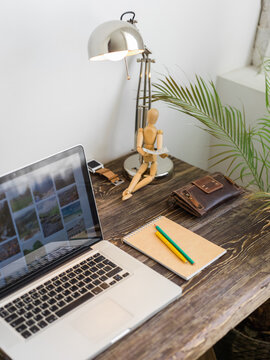 Empty office workplace with laptop and notepad