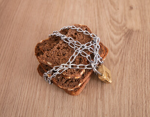Slices of bread locked by chains