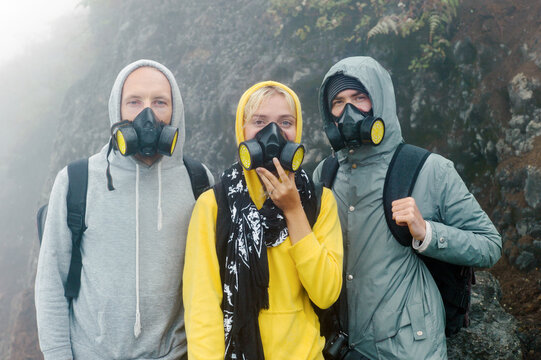 Three young people in masks