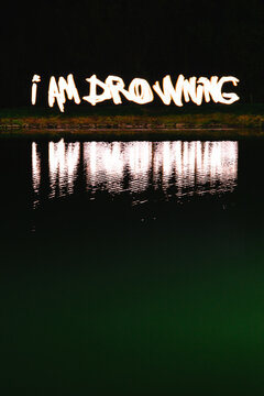 I am drowning message made of light
