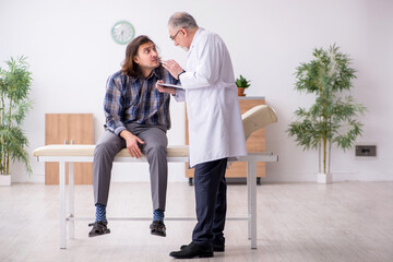Young male patient visiting experienced doctor psychiatrist
