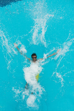 Asian sport man swimming in the pool.