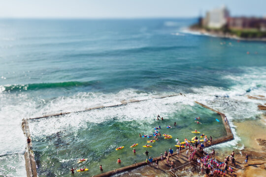 Nippers learning surf lifesaving skills in a rock pool