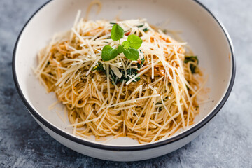 plant-based food,  vegan mushroom spaghetti with dairy-free parmesan topping