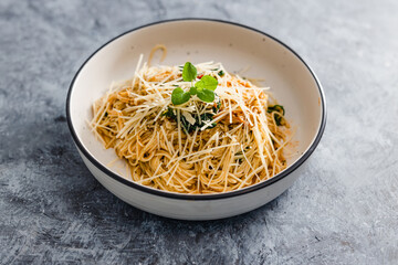 plant-based food,  vegan mushroom spaghetti with dairy-free parmesan topping