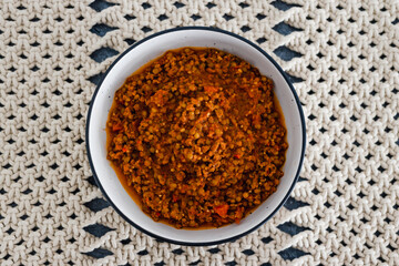 plant-based food, vegan bolognaise ragu sauce with lentils diced tomatoes and textured vegetable protein with mixed herbs and spices