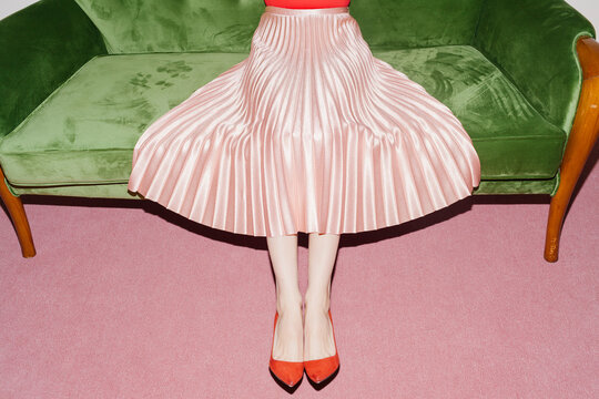 woman with pink pleated skirt