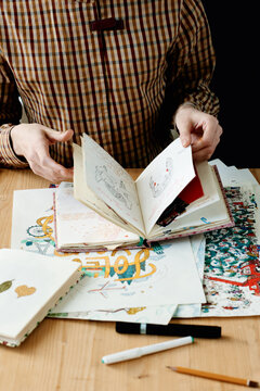 Young illustrator with sketchbook