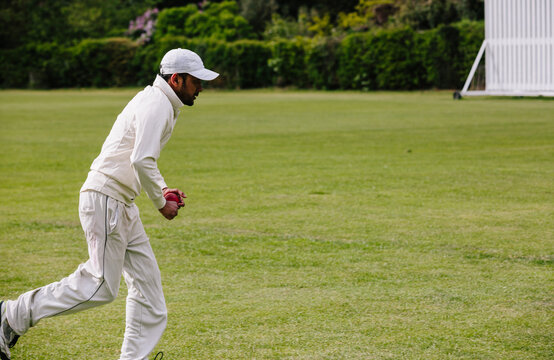 Cricket bowler running towards the wicket