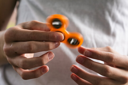 Spinner: Teen Girl Playing With Fidget Toy