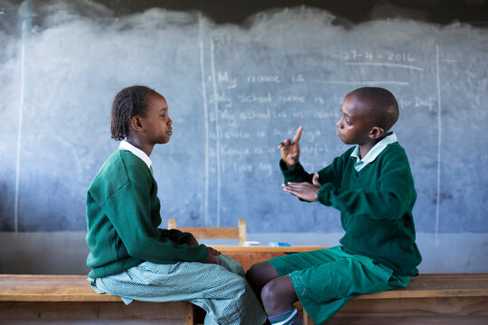 Deaf school children learning sign language