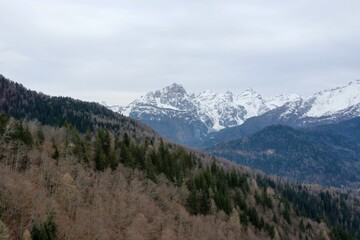 aerial snow covered mountain peaks in alps at winter 