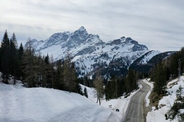 Fototapeta na wymiar aerial snow covered mountain peaks in alps at winter 