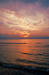 Beautiful sunset along the coast with purple and pink sky
