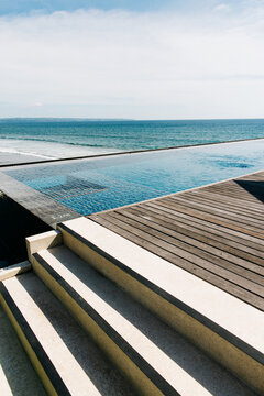 Sundeck and Infinity Swimming Pool in Upscale Beach Resort