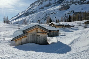 aerial snow covered mountain peaks in alps at winter 