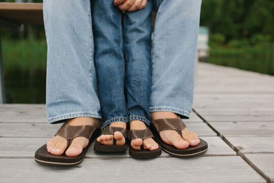 feet of a father and his son