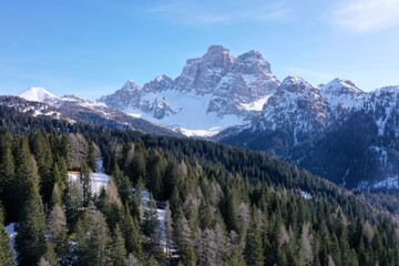 aerial snow covered mountain peaks in alps at winter 