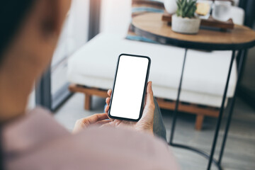 cell phone mockup blank white screen.woman hand holding texting using mobile on desk at coffee shop.background empty space for advertise.work people contact marketing business,technology