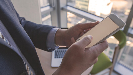 Hand of a person using a smartphone