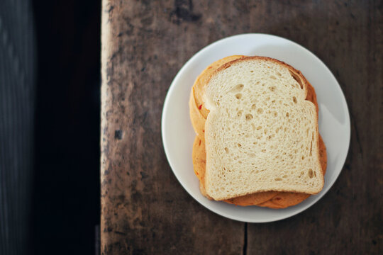 Overhead shot of filled sandwich on wooden table