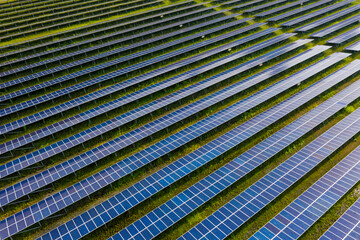 Solar Photovoltaic of aerial top view, solar plant rows array of ground mount system Installation