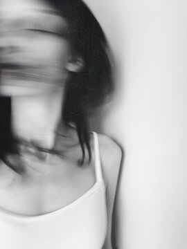 Movement shot of woman flicking her hair