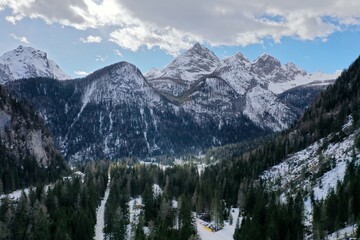 aerial snow covered mountain peaks in alps at winter 