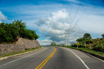 Fototapeta na wymiar Curve in road colombia in the countryside on a blue sky day