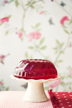 Red jello on a cakestand