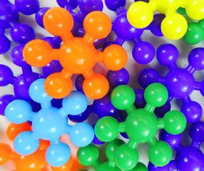   abstract filled background of colored details of the children's constructor in the form of flowers   