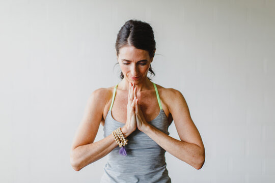 A beautiful woman practicing yoga in a studio
