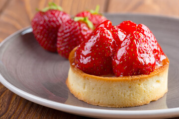 Mini tart with strawberries close up. Berry dessert