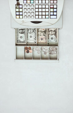 Money: Overhead View Of Cash Register And Open Drawer