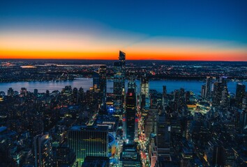 sunset over the city New York beautiful view colors orange blue 