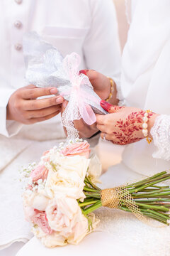 The groom giving the wedding dowry to the bride