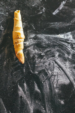 pastry on floury black background