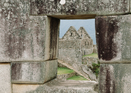 An Inca ruin at Machu Pichu shot though an arch