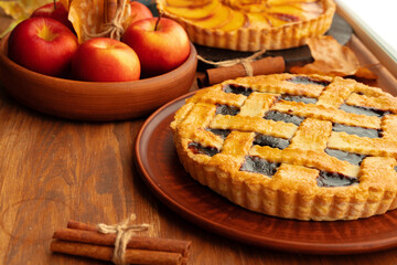 Close up of homemade traditional sweet autumn raspberry tart pie on wooden table