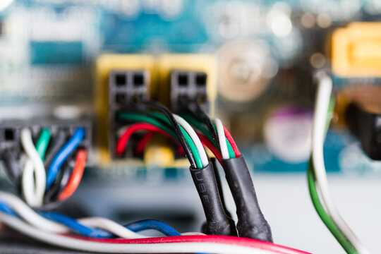 Multi coloured wires on the motherboard of a computer