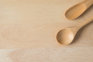 Top view of Wooden scoop on wood background  and copy space