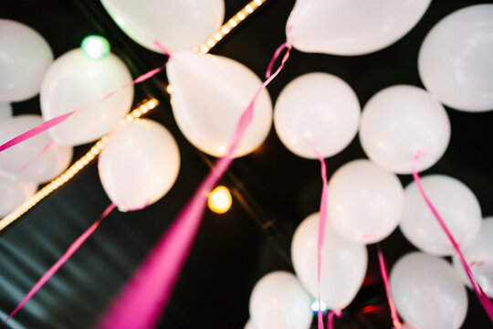 Birthday balloons hanging under ceiling