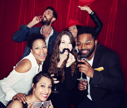 Portraits: Group Of Friends Having Fun In Photo Booth