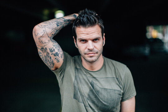 Portrait of a handsome tattooed man in a t-shirt