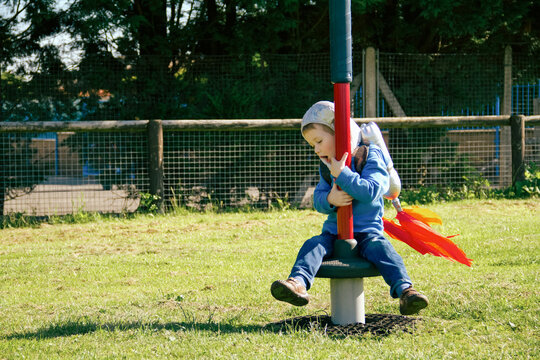 Boy plays in rocket pack costume, pretends to be astronaut
